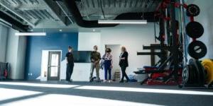 People stand inside a fitness space in Shenandoah University's new Wilkins Health & Fitness Suite.